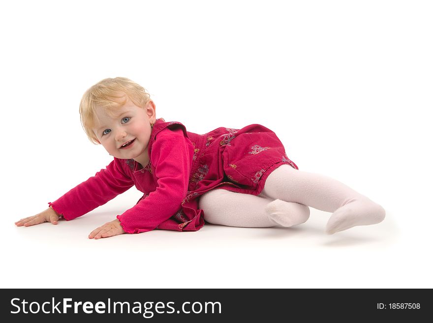 Smiling child lies, on white background.