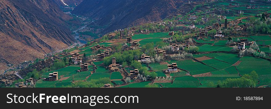 Village in valley, view in Tibet