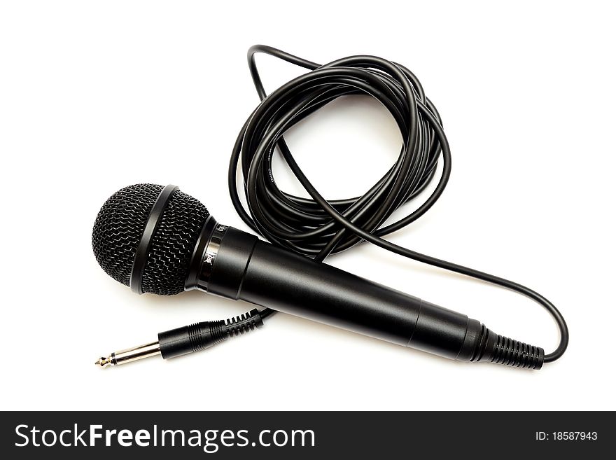 Photo of a black microphone on a white background. Photo of a black microphone on a white background
