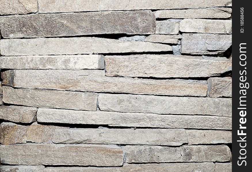Stone wall flat stacked background and texture. Stone wall flat stacked background and texture