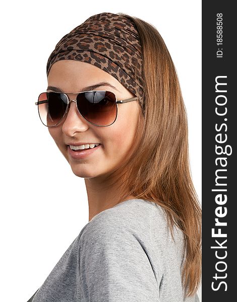 Portrait of a girl with glasses in a leopard scarf on a white background