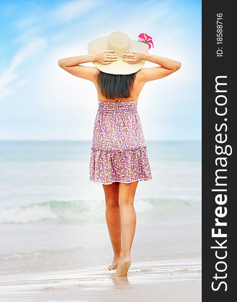 Young beautiful woman on beach background