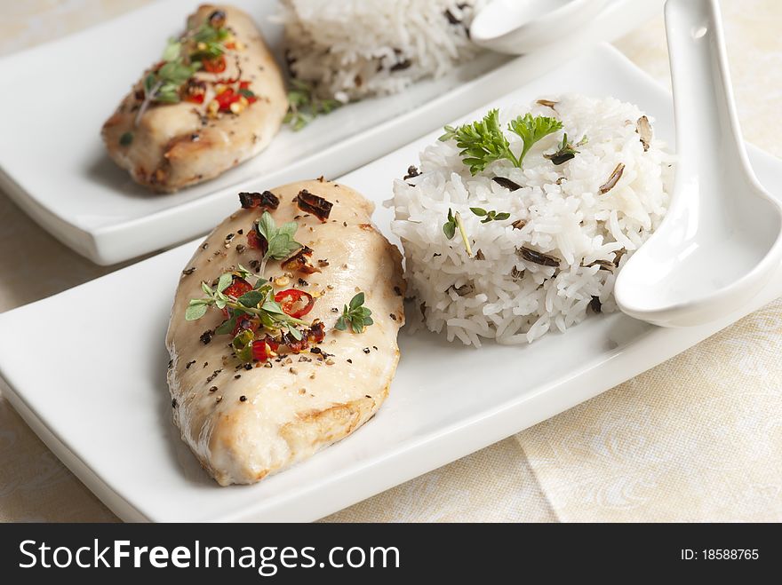 Grilled chicken breast with basmati rice on a plate. Grilled chicken breast with basmati rice on a plate