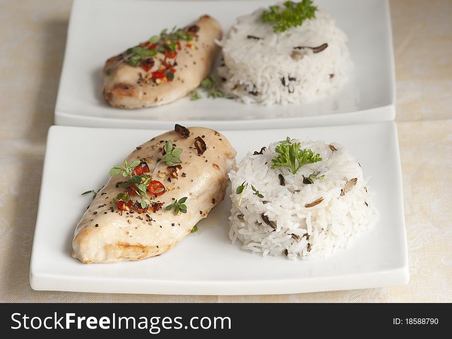 Grilled chicken breast with basmati rice on a plate. Grilled chicken breast with basmati rice on a plate