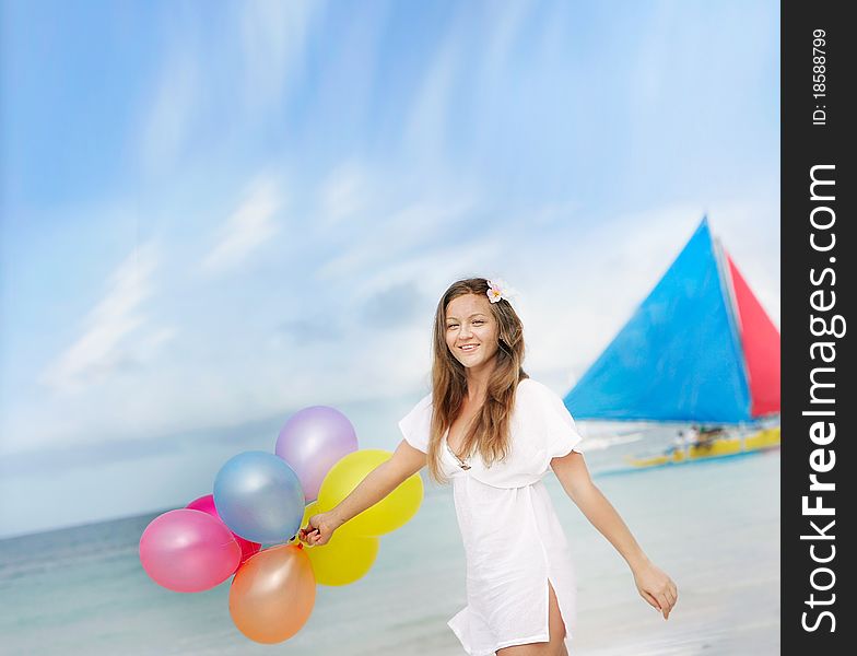 Woman with balloons on sea background