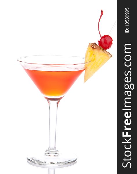 Red Cosmopolitan martinis cocktail with vodka, rum, liqueur, lemon juice, pineapple, maraschino cherry in martini glass isolated on a white background. Red Cosmopolitan martinis cocktail with vodka, rum, liqueur, lemon juice, pineapple, maraschino cherry in martini glass isolated on a white background