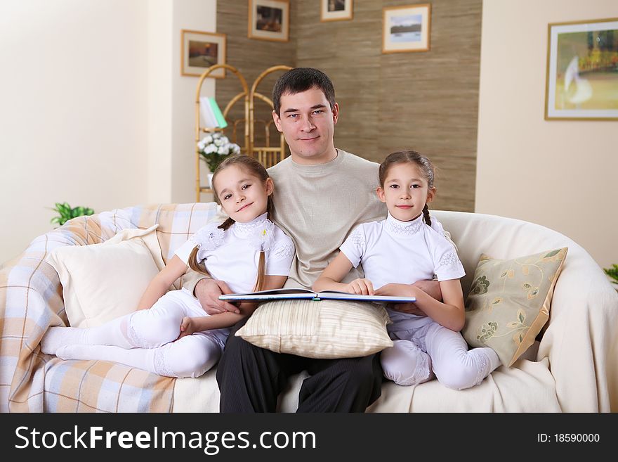 Father With His Daughters At Home
