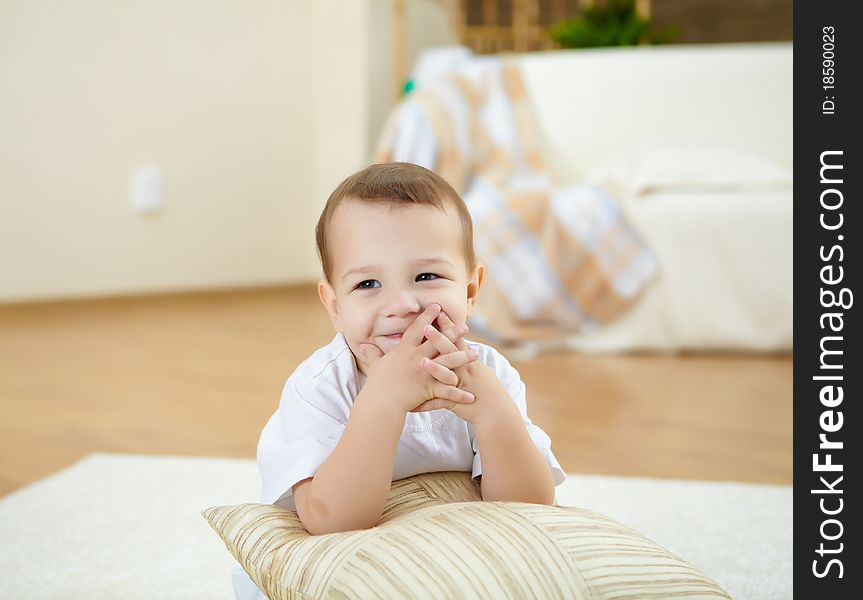 Happy Smiling And Laughing Boy At Home