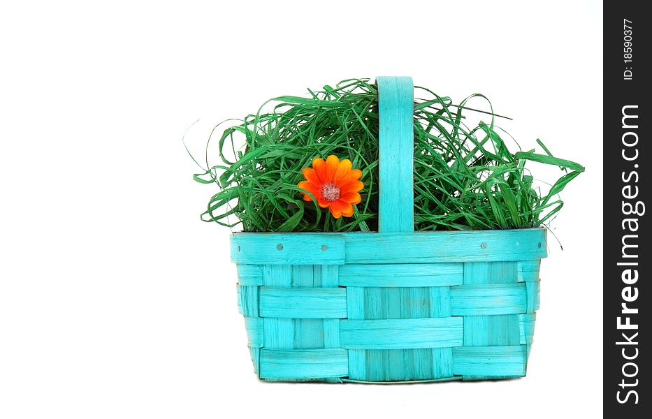 Blue wicker basket with flowers isolated on white background. Blue wicker basket with flowers isolated on white background
