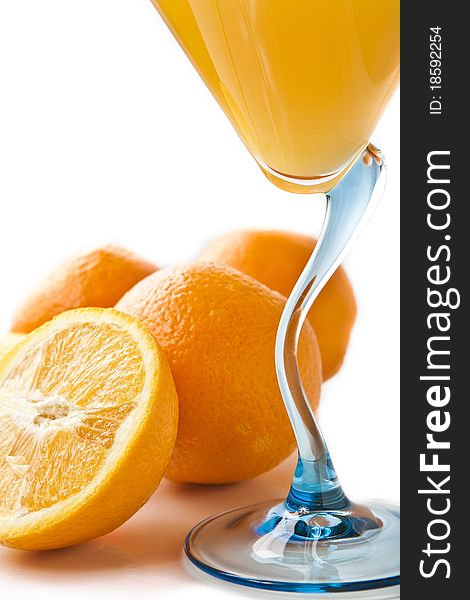 Wine glass with orange juice and fruit