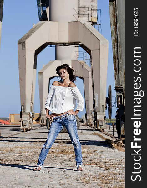 View of a beautiful girl posing on the docks