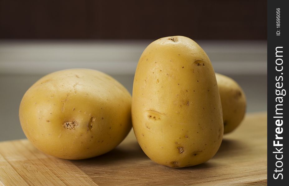 Group of potatoes waiting on breadboard