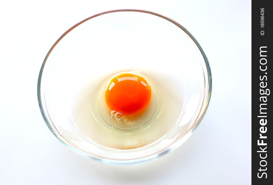 Broken chicken egg in the bowl as food ingredient ready for cooking