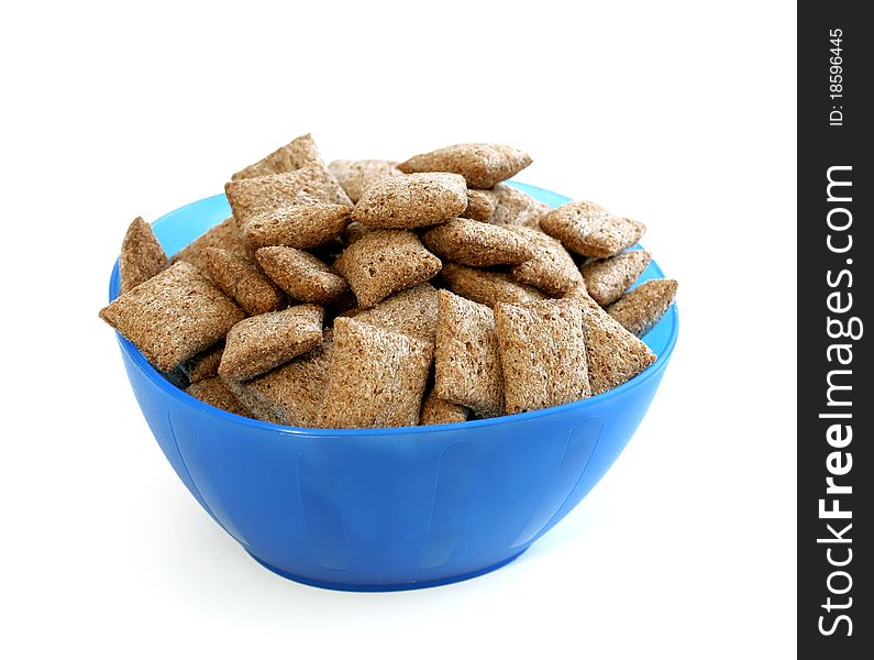 Chocolate muesli in blue bowl isolated on white background