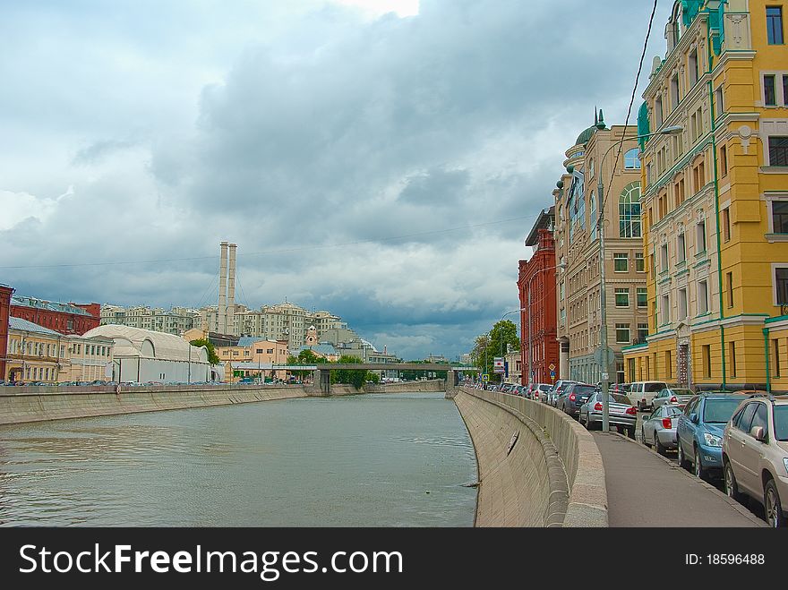 Moscow river embankment houses tubes clouds