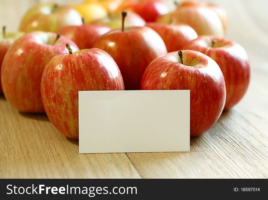 With blank card and red apples on wooden boards. With blank card and red apples on wooden boards