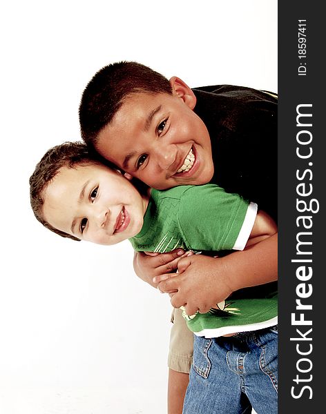 Happy children hugging on a white background