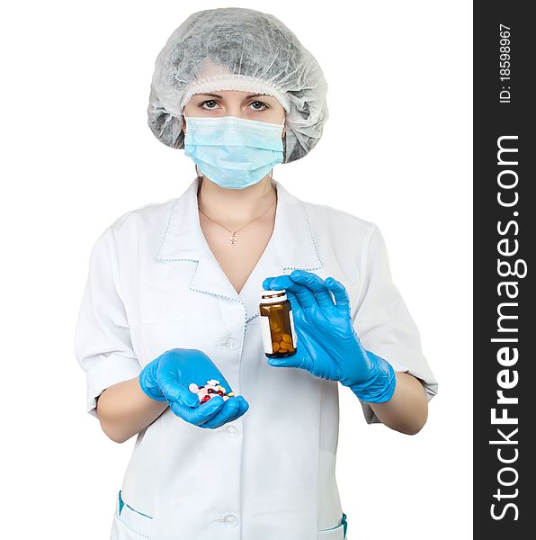 Nurse with pills on white background