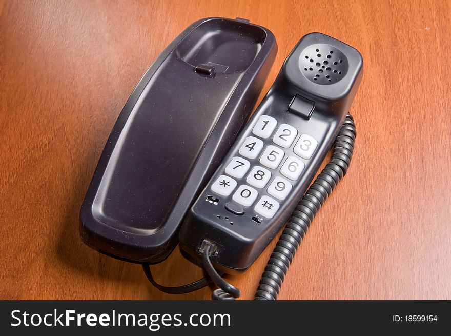 Wired office phone on a office desk. Wired office phone on a office desk