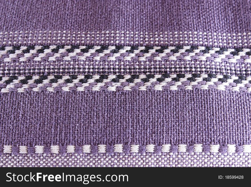 Loose weave fabric on a throw pillow. Loose weave fabric on a throw pillow