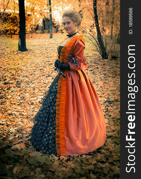 Baroque girl in autumn park. Baroque girl in autumn park