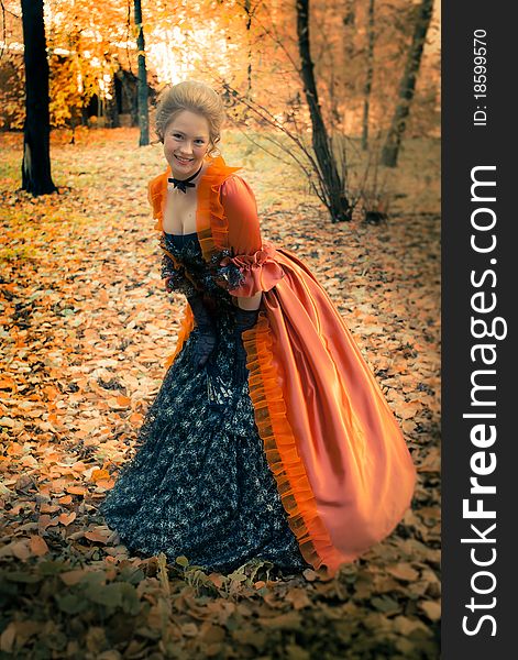 Baroque girl in autumn park. Baroque girl in autumn park