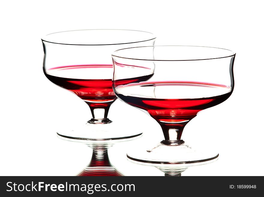 Two wine glasses with wine. White background. Studio shot.