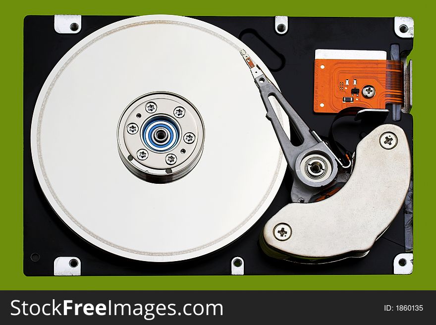 Open hard disk drive, in a green background. Open hard disk drive, in a green background