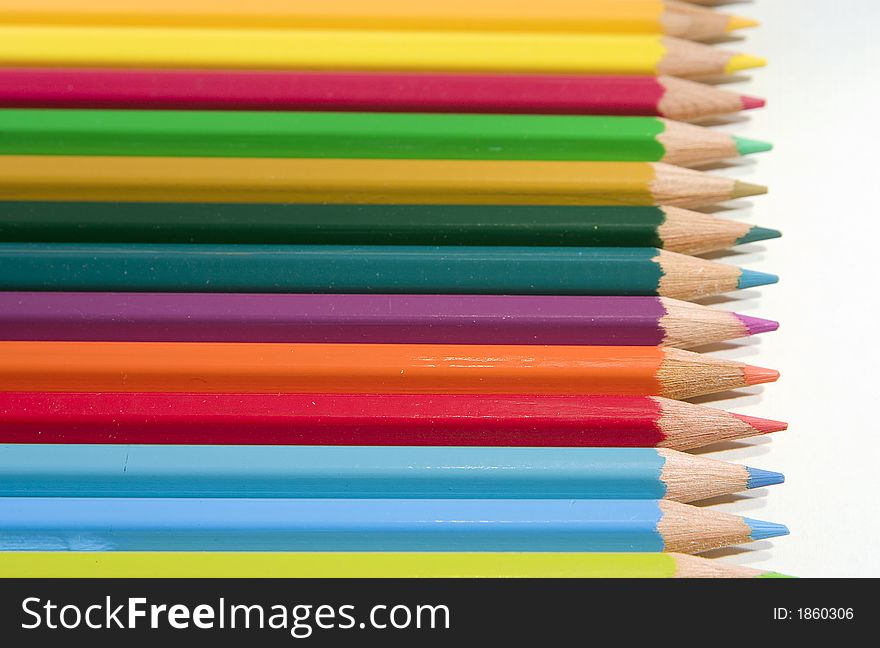 Colourful pencils of different colours on a white background. Colourful pencils of different colours on a white background
