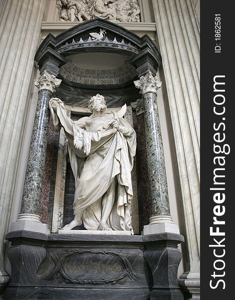 Statue of Saint Barholomew, the martyred apostle holding his flayed skin and flaying knife in Basilica of St. John Lateran in Rome. Statue of Saint Barholomew, the martyred apostle holding his flayed skin and flaying knife in Basilica of St. John Lateran in Rome