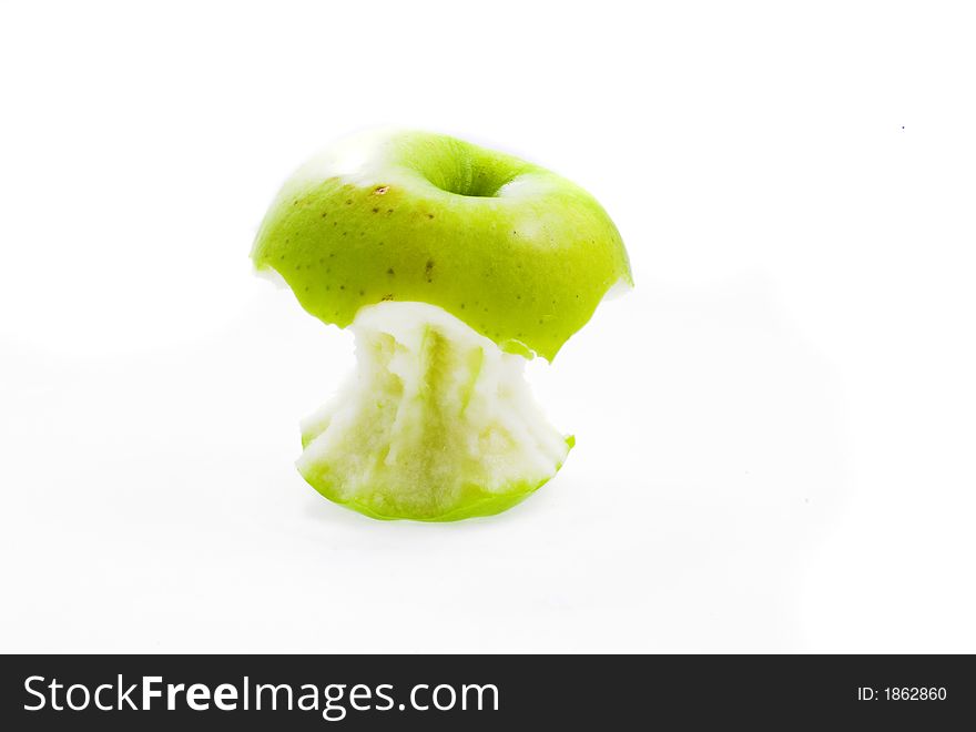 Eating green apple on white background