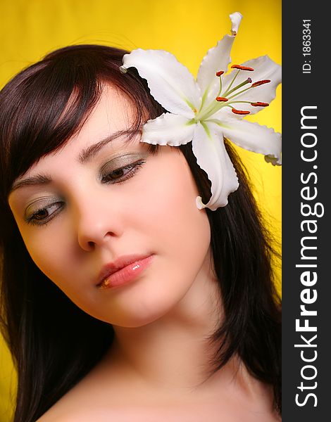 Brunette with white lily flowers