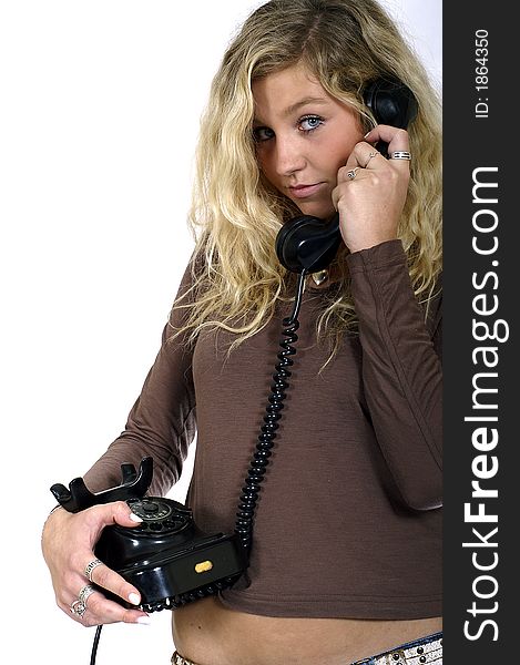 Young sexy blond woman with a telephone in hand. Young sexy blond woman with a telephone in hand