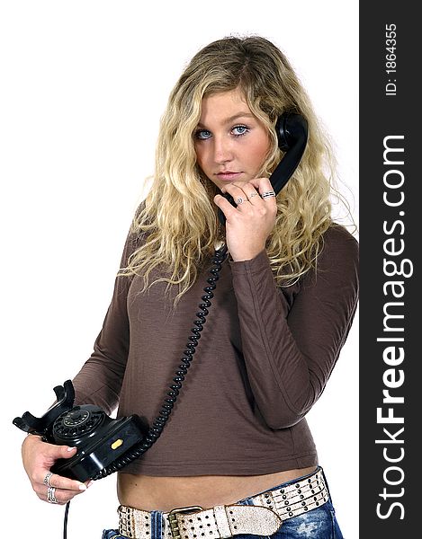 Young sexy blond woman with a telephone in hand. Young sexy blond woman with a telephone in hand