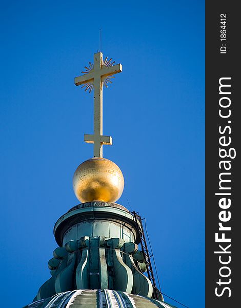 Gold cross at top of the Kazan cathedral in St.-Petersburg. Gold cross at top of the Kazan cathedral in St.-Petersburg