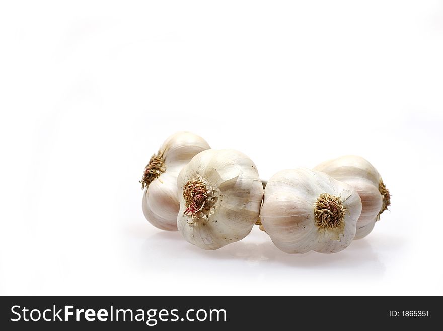 Pieces of garlic isolated on white background