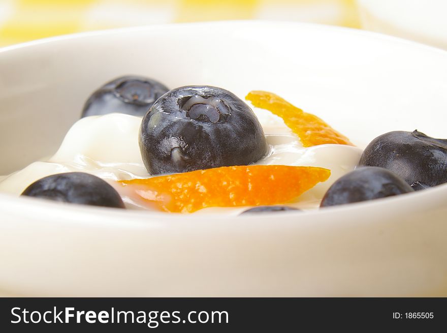 Healthy snack of blueberries and yogurt, garnished with orange zest. Healthy snack of blueberries and yogurt, garnished with orange zest.