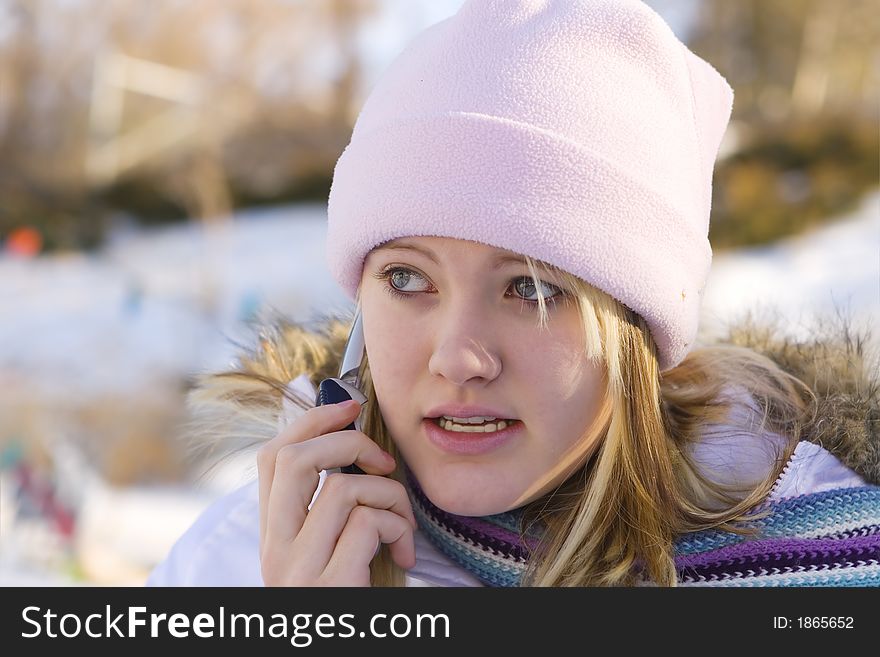 Teenager out in the cold talking on a cellphone. Teenager out in the cold talking on a cellphone