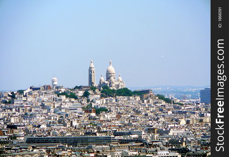 Basilica of Sacre Coeur and the city of Paris from the Eiffel Tower. Basilica of Sacre Coeur and the city of Paris from the Eiffel Tower