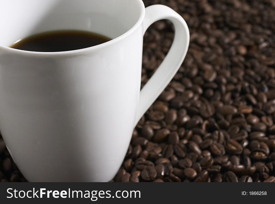 Coffee cup macro with coffee beans. Coffee cup macro with coffee beans