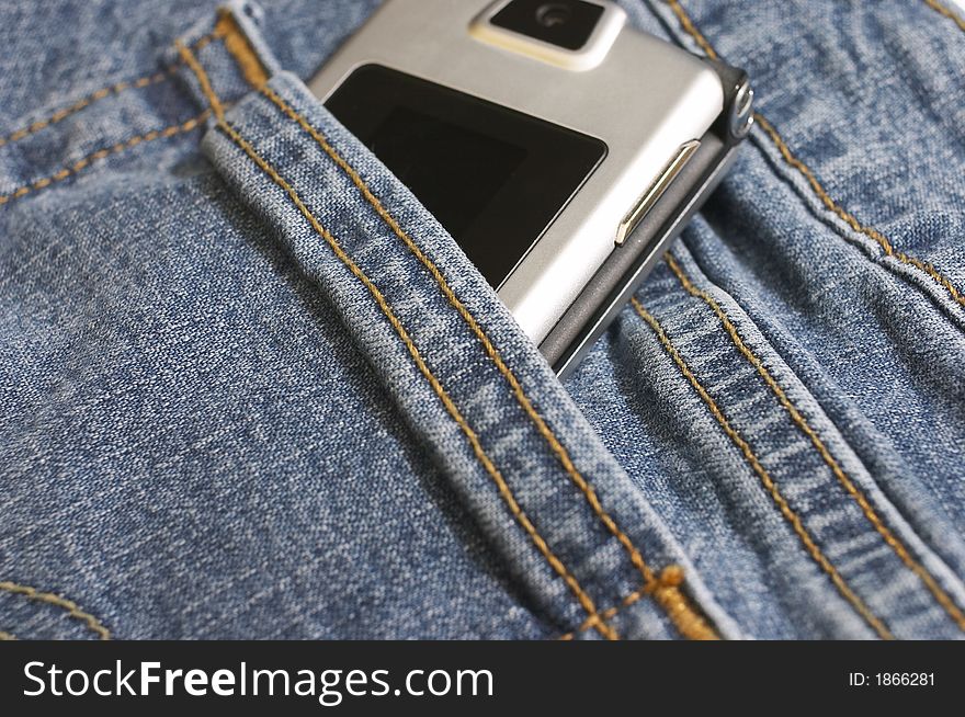 Macro of cell phone in jean pocket. Macro of cell phone in jean pocket
