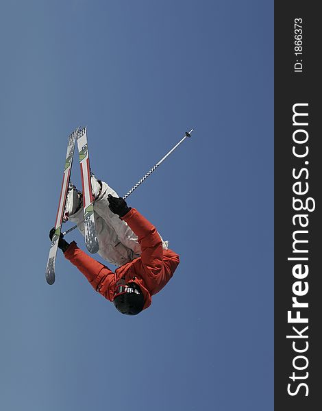 A talented freestyle skier blasts an inverted truck driver air off a jump. A talented freestyle skier blasts an inverted truck driver air off a jump.