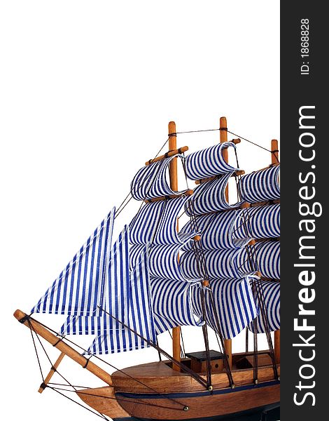 Toy sailing boat on white background