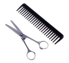 Hairdressing Scissors And Comb Royalty Free Stock Photography