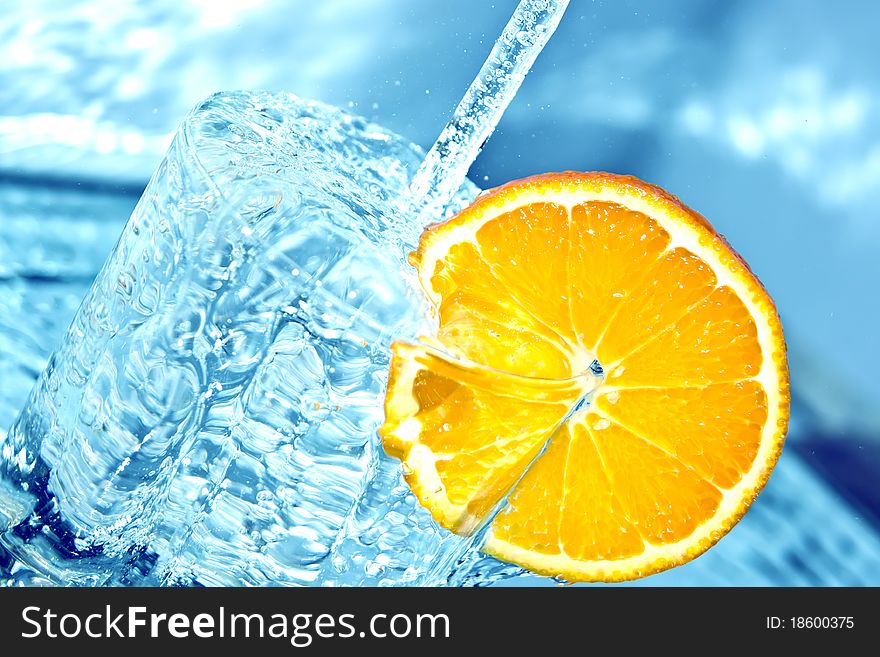 Orange In Water Splash