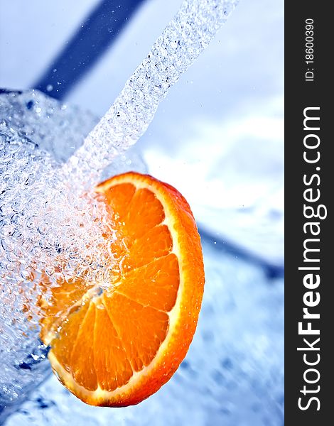 Fresh orange in water splash