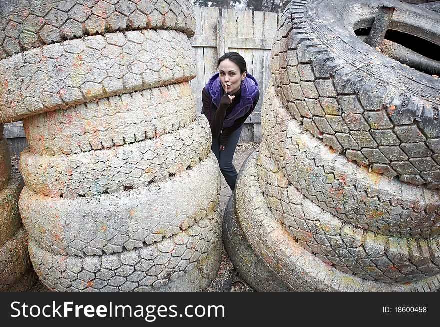 Girl playing Paintball game and hiding herself. Girl playing Paintball game and hiding herself