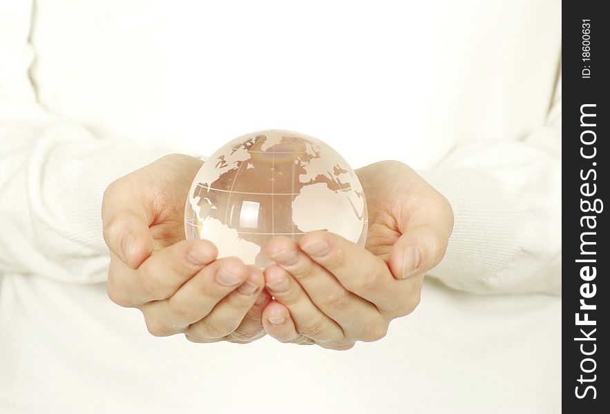 Globe on the human hand on white. Globe on the human hand on white