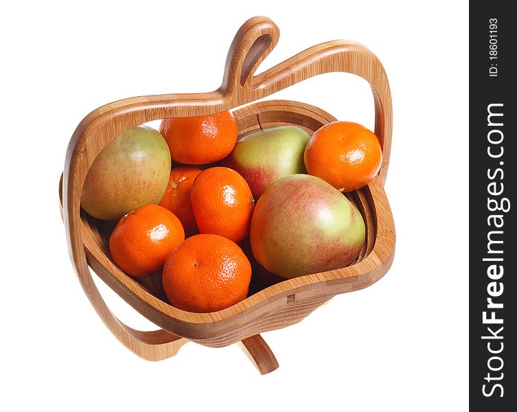 Tangerines and apples in a wooden basket