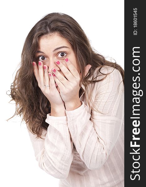 Portrait of a surprised young woman with hands over her mouth. Portrait of a surprised young woman with hands over her mouth